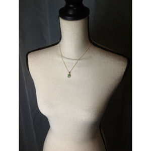Necklace Gold Colored with Green and Clear Stones on a Teardrop Pendant